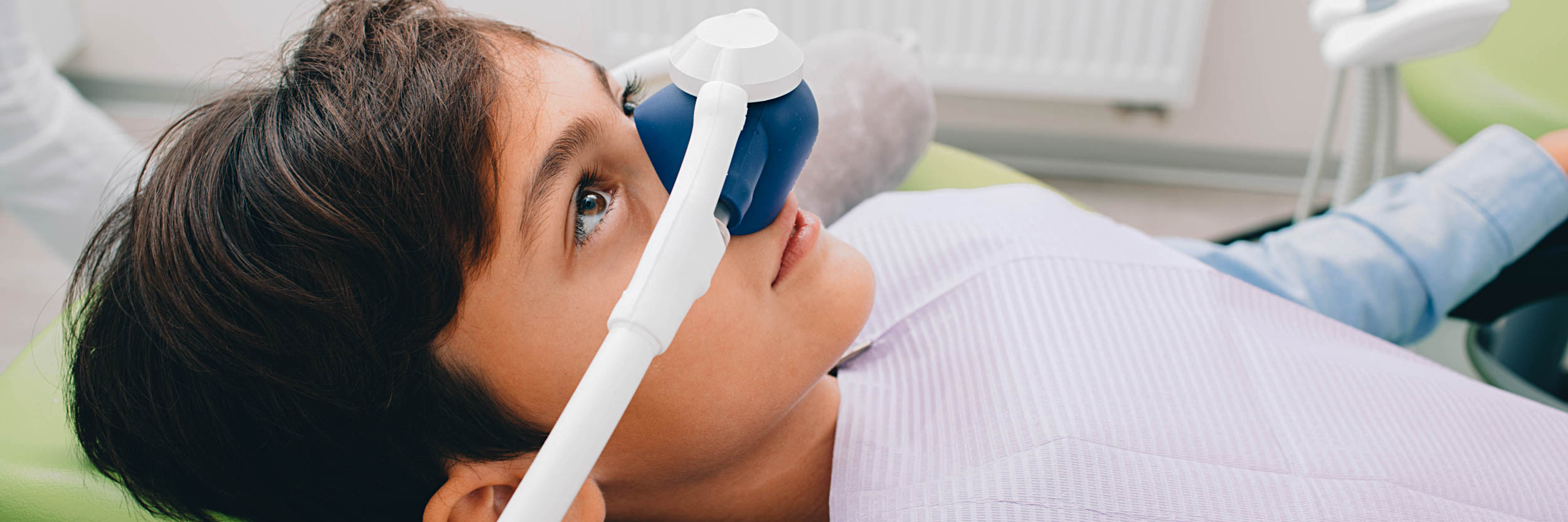 A young boy undergoing dental sedation