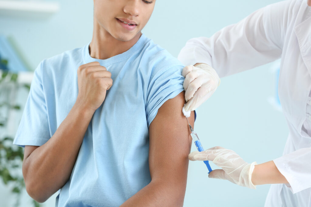 A child getting a shot from a doctor